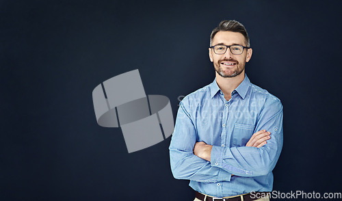 Image of Portrait, business and man with arms crossed, mockup and employee against dark studio background. Face, male person and entrepreneur with startup success, career and ceo with a smile and professional