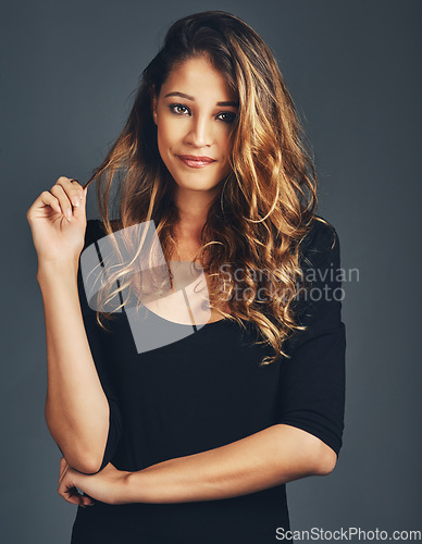 Image of Portrait, face and fashion of woman in studio with natural beauty, hair care and aesthetic makeup on background. Beautiful female model with confidence, casual style and curly hairstyle on backdrop