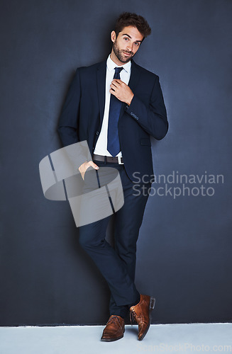 Image of Portrait, fashion and a corporate business man in studio on a grey background mockup for executive style. Success, professional and a confident young male employee in a suit for formal mock up power