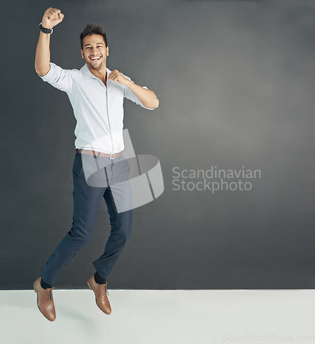 Image of Portrait, mockup and man with business, happy and excited guy against a dark studio background. Face, male person and employee with happiness, winning and achievement with career and professional