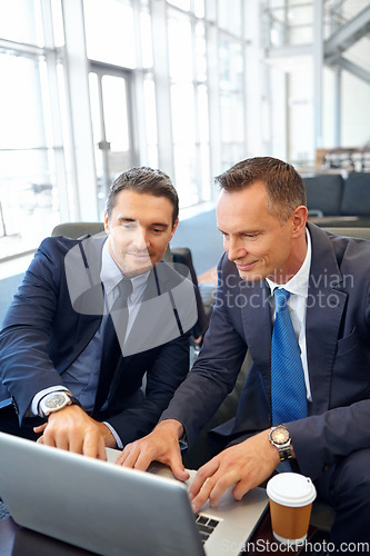 Image of Laptop, negotiation meeting and businessman and client in company lobby for strategy, planning or feedback. Professional people, financial advisor or businessman talking to partner of investment plan