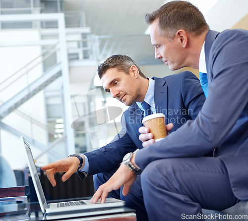 Image of Laptop, corporate lounge and business people working on portfolio review, stock market or trading investment. Financial economy, partnership and profile of trader point at nft, bitcoin or forex data