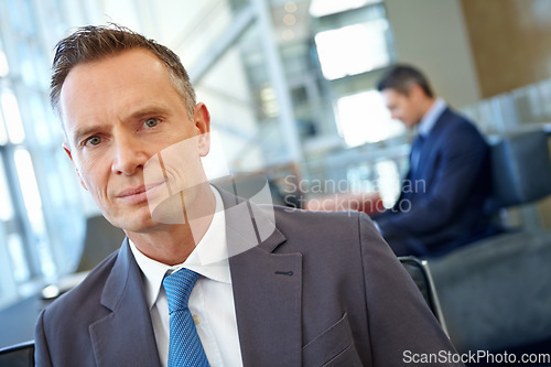 Image of Portrait, corporate travel and business man in airport, hotel or office building lobby and career mindset for opportunity. Professional manager, CEO or serious person for company or work leadership