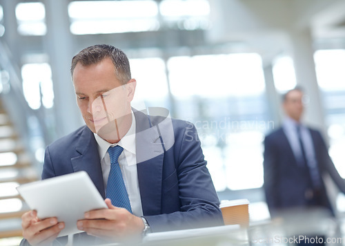 Image of Focus, corporate and businessman with tablet for networking, finance growth and financial review. CEO, employee and manager in office building planning, data analysis and economy data analytics study