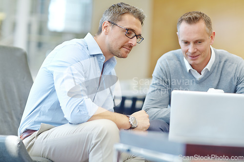 Image of Meeting, planning and businessman or clients on laptop in company lobby for strategy, planning or feedback. Professional people, financial advisor or employee talking to partner of startup investment