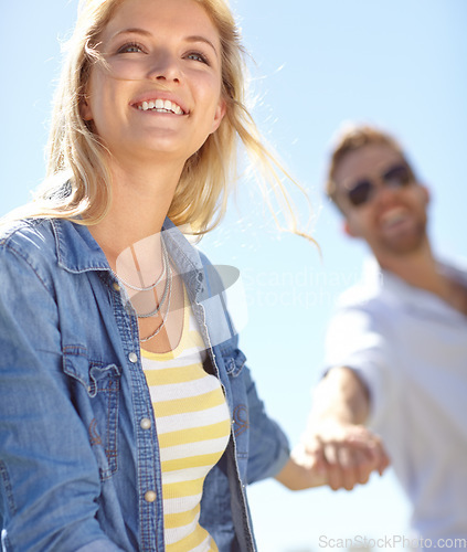 Image of Love, holding hands and couple walking, happy and enjoy outdoor quality time together, bond and fun romantic date. Freedom, peace and happiness for man and woman on summer holiday in Lisbon Portugal