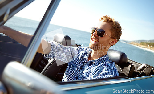 Image of Car road trip, travel and laughing man on holiday adventure, transportation journey or fun summer vacation. Ocean sea, convertible automobile and happy driver driving on Australia countryside tour