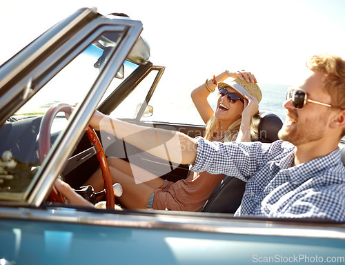 Image of Car road trip, travel and happy couple laughing on holiday bond adventure, transportation journey or fun summer vacation. Love flare, convertible vehicle and driver driving on Canada countryside tour
