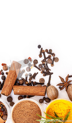 Image of Table top, powder and food spices in studio isolated on white background mockup. Turmeric seasoning, kitchen condiments and variety of plant herbs in bowls for brunch, healthy diet or cooking flavor.