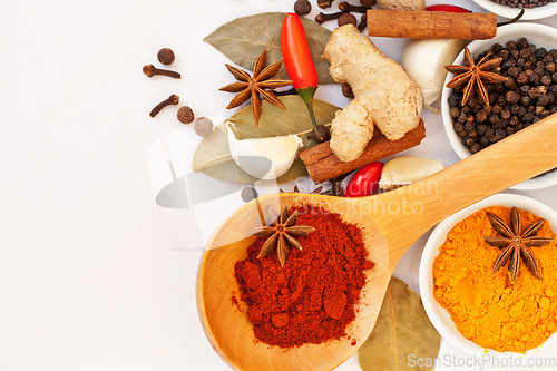 Image of Powder, table top and food spices in studio isolated on white background mock up. Turmeric seasoning, kitchen cooking and variety of leaf herbs in bowls for brunch, healthy diet and paprika in spoon.