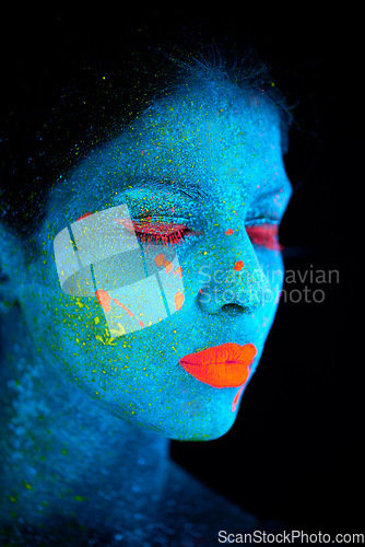 Image of Neon paint, face makeup and woman closeup with dark background and creative cosmetics. Glow, fantasy and psychedelic cosmetic of a female model with unique and creativity with art in studio