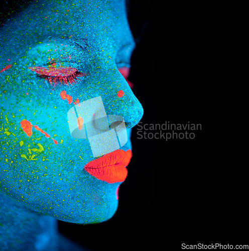 Image of Neon paint, makeup and woman face with beauty closeup in dark background and creative cosmetics. Glow, fantasy and psychedelic cosmetic of female model with unique and creativity with art in studio