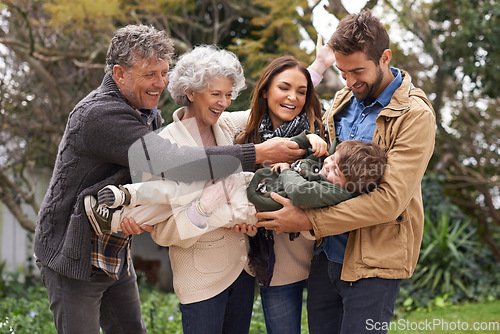 Image of Happy family, child and grandparents playing with parents in a park on outdoor vacation, holiday and excited together. Backyard, happiness and people play with kid as love, care and bonding in nature