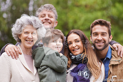 Image of Big family, happy and grandparents or parents with kid in a park on outdoor vacation, holiday with faces together. Mother, happiness and father smile with child for love, care and bonding in nature