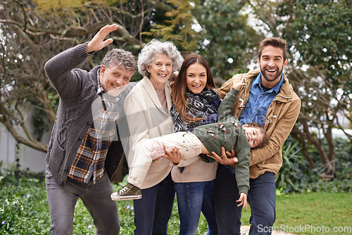 Image of Family, happy and portrait of parents with kid in a park on outdoor vacation, holiday and excited together. Grandparents, happiness and people play with kid as love, care and bonding in a backyard