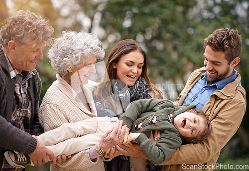 Image of Happy family, child and parents in happiness with kid in a park on outdoor vacation, holiday and excited together. Grandparents, happiness and people play as love, care and bonding in nature