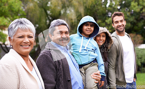 Image of Big family, smile and portrait in park with kid, parents and grandparents with love, care or happiness. Group, senior people and child with bonding, walking and diversity in garden, nature on holiday