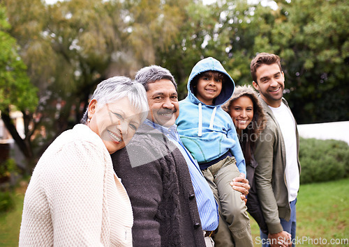 Image of Big family, portrait and generations in park with kid, parents or grandparents for love, care and happiness. Group, senior people and child for bond, walking and support by trees, nature or holiday