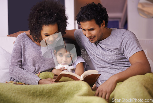 Image of Family, child and reading a book together in a home for story time on a lounge sofa with a smile. A woman, man or parents and girl kid for development, learning and love with a fantasy or fairytale