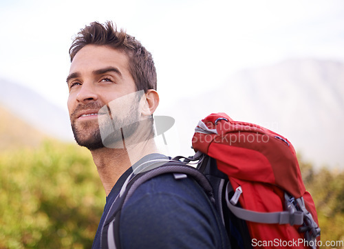 Image of Hiking, happy and relax with man on mountain for fitness, adventure and travel journey. Backpack, summer and workout with male hiker trekking in nature path for training, freedom and explore