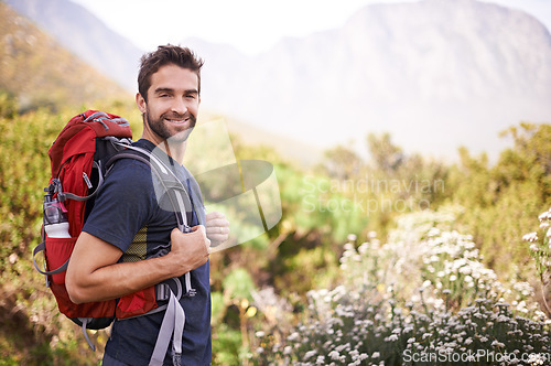 Image of Hiking, happy and portrait of man on mountain for fitness, adventure and travel journey. Backpacking, summer and workout with male hiker trekking in nature path for training, freedom and explore