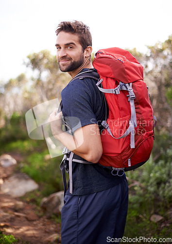 Image of Hiking, walking and portrait of man on mountain for fitness, adventure and travel journey. Backpack, summer and workout with male hiker trekking in nature path for training, freedom and explore