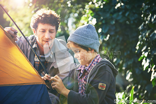 Image of Father, child and set up tent for camping outdoor in nature on vacation while bonding in summer. Dad, boy and preparing campsite, learning and getting ready in forest for travel, education or holiday