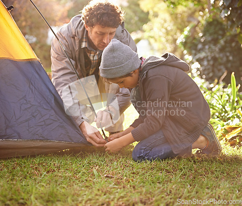 Image of Dad, child and preparing tent for camping outdoor in nature on vacation while bonding in summer sunset. Father, boy and setting up camp, learning and getting ready in forest for adventure or travel.