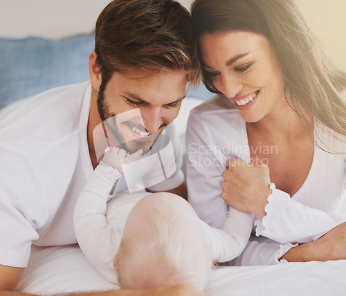 Image of Happy family of mother, father and baby in bedroom for love, care and quality time together. Parents, newborn kid and relax on bed with smile, childhood development and support to nurture at home