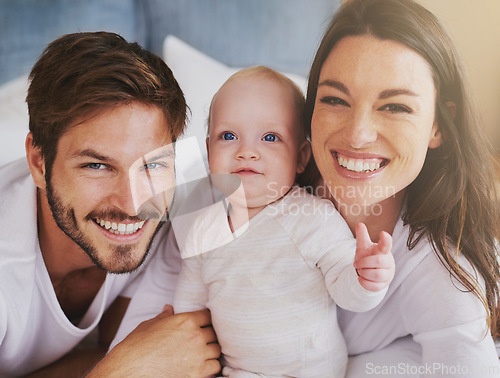 Image of Portrait of happy family, baby and parents with love, care and quality time together at home. Mom, dad and cute newborn kid relaxing with smile, happiness and support of healthy childhood development