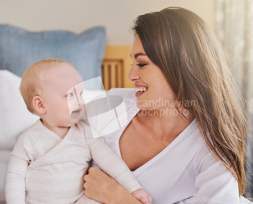 Image of Mother, baby and smiling together or embracing daughter and having fun in the bedroom feeling happy. Parent, kid and mom bonding or carefree and excited together in the house or parenthood