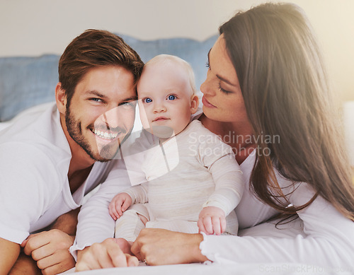 Image of Happy father, mother and baby for love, care and quality time to relax together in family home. Mom, dad and parents with cute infant kid for happiness, support and newborn development