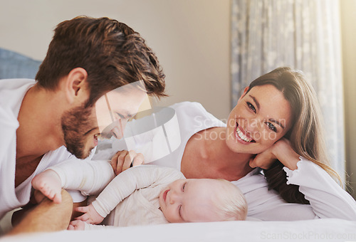 Image of Portrait of happy mother, father and baby in bedroom for love, care and quality time to relax together in house. Mom, dad and smile with cute infant kid for happiness, support and newborn development