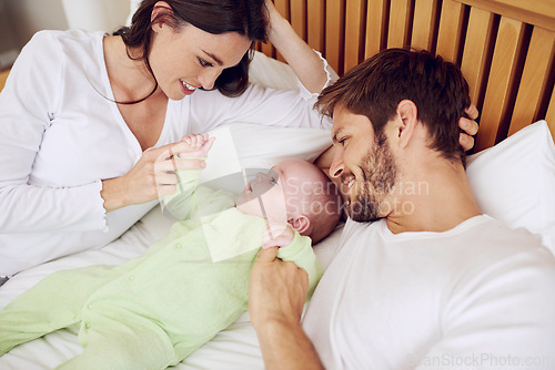 Image of Top view of mother, father and baby in bedroom for love, care and quality time together at home. Happy parents, family and newborn kid relax on bed with support, childhood development and nurture