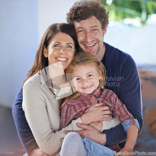 Image of Family hug in portrait, relax in backyard with mom and dad with kid with love and care outside house. Faces of happy people with smile, woman and man with girl child together at home outdoor