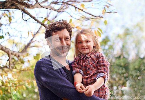 Image of Happy, hugging and faces of father and daughter under tree in garden for smile, bonding or affectionate. Portrait, relax and excited with man and young girl in outdoors for embrace, autumn and care