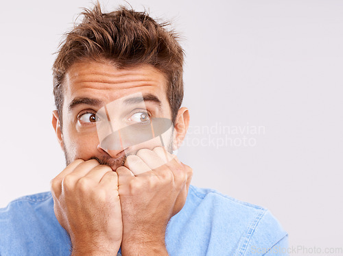 Image of Portrait, bite nails and man with anxiety, mental health or depression with guy isolated on white studio background. Face, male person or model with bad habit, mockup or anxious with problem or issue