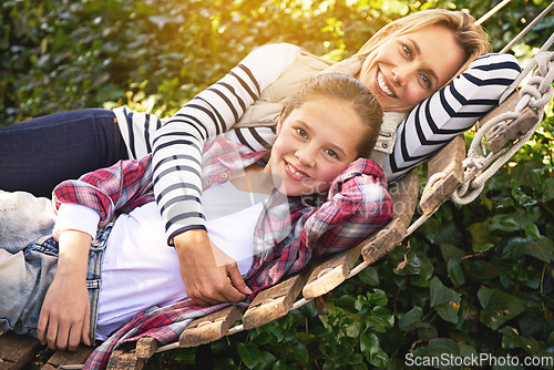 Image of Portrait, hammock and relax happy child, mother and family bonding, care and spending quality time together. Happiness, smile and Canada mom, kid or people enjoy Mothers Day in backyard nature garden