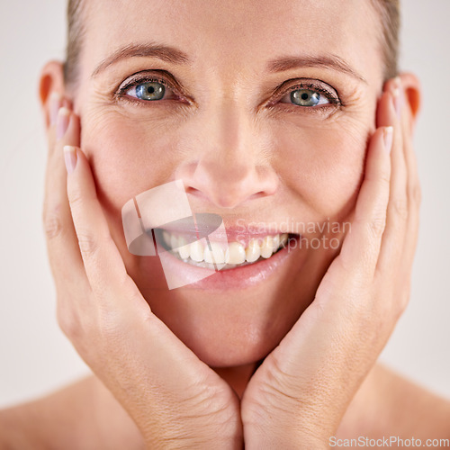 Image of Portrait, smile and senior woman skincare or wellness for face or beauty or isolated and on grey background. Makeup, mature lady and wrinkles or happy model or dermatology and facial aging process