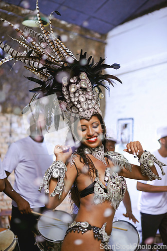 Image of Celebration, party and exotic female dancer dancing with a band at mardi gras or cultural festival. Performance, costume and woman performing a dance with rhythm to live music at a carnival in Brazil