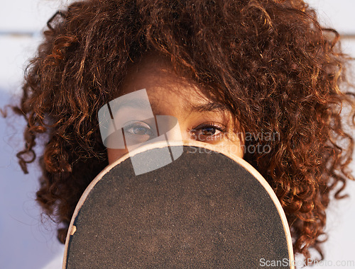 Image of Eyes, cover and portrait of woman with skateboard for fitness, urban and hiding in outdoors. Training, skating and youth with face of female skater in park for hipster, relax and skateboarder