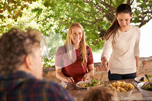 Image of Food, party or preparation with family at lunch for health, bonding or celebration. Thanksgiving, social or event with parents and children eating together for dining, generations or outdoor wellness