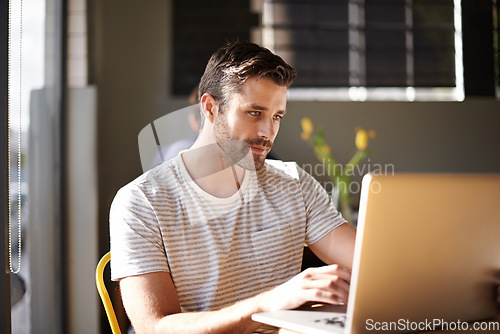 Image of Entrepreneur, laptop or man in coffee shop reading news online the stock market for trading report update. Cafe, remote work or trader typing an email or networking on internet or digital website