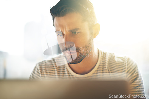 Image of Entrepreneur, laptop or serious man in cafe reading news online the stock market for trading report update. Coffee shop, remote work or focused trader typing an email or networking on digital website