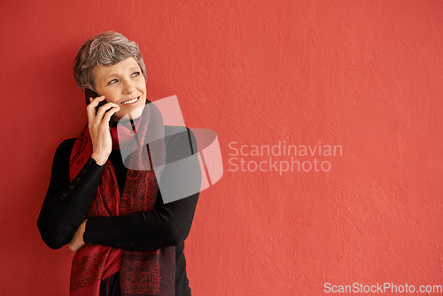 Image of Mature woman, phone call and smile by wall with space for mockup, communication and listen by red background. Senior lady, smartphone and think of idea in mock up for chat, networking and talking