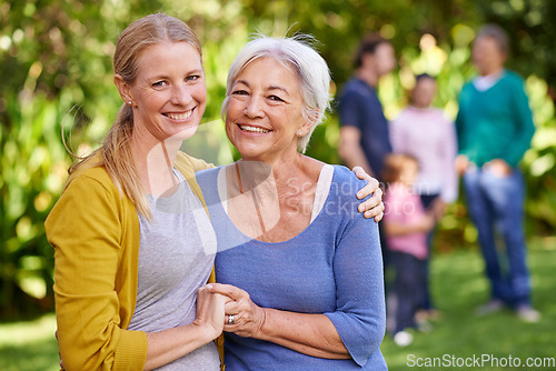 Image of Senior mom, woman and hug in garden with happiness, love and care in portrait by trees on holiday. Elderly mama, lady and embrace with bond, excited face and family in backyard with summer sunshine