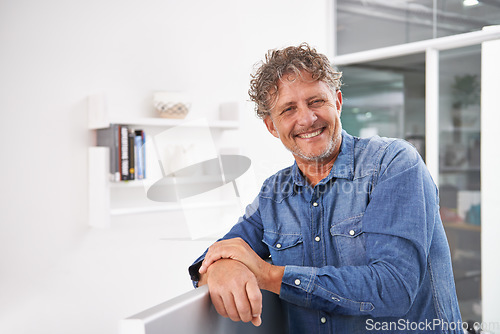 Image of Portrait, smile and business man in office with pride for career or creative job. Entrepreneur, professional and male designer, confident boss and mature person from Australia leaning on computer.