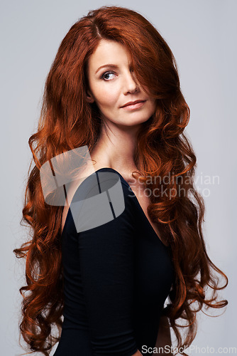 Image of Red hair, beauty and ginger woman in studio for keratin treatment, wellness and haircare on white background. Salon, hairdresser and female model thinking with shine, healthy and natural hairstyle