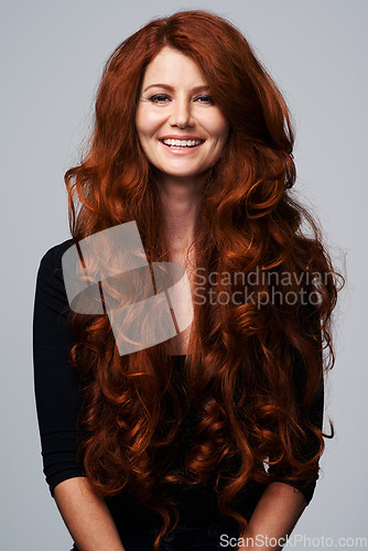 Image of Red hair, happy and portrait of woman in studio for keratin treatment, wellness and haircare on white background. Salon, hairdresser and ginger female model with beauty, healthy and natural hairstyle