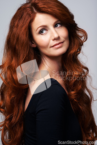 Image of Red hair, beauty and face of woman in studio for keratin treatment, wellness and haircare on white background. Salon, hairdresser and ginger female model with shine, healthy and natural hairstyle